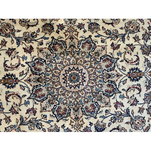 190 - A Central Persian Kashan garden Carpet, all over decorated with floral sprays in red, blue, green on... 