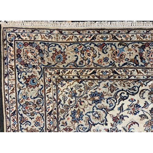 190 - A Central Persian Kashan garden Carpet, all over decorated with floral sprays in red, blue, green on... 