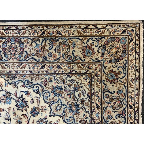 190 - A Central Persian Kashan garden Carpet, all over decorated with floral sprays in red, blue, green on... 