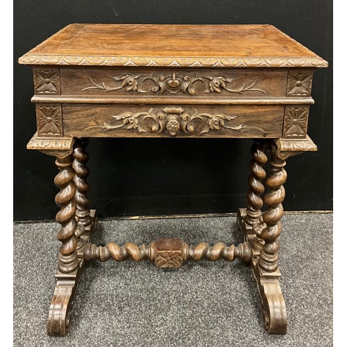 192 - A carved oak Gothic Revival side table/Travailleuse, hinged top with inset rectangular mirror, gothi... 