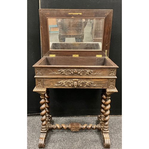 192 - A carved oak Gothic Revival side table/Travailleuse, hinged top with inset rectangular mirror, gothi... 