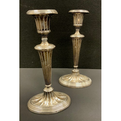 252 - A pair of silver candlesticks, oval weighted base, marks worn possibly Sheffield 1900, 25.5cm high