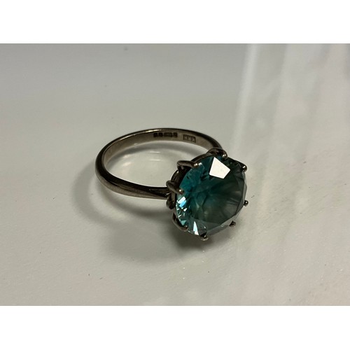 306 - A pale blue stone possibly zircon 18ct white gold solitaire ring, round stone approx 11.5mm x 11,4mm... 