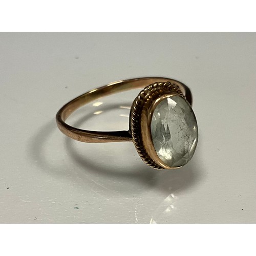 315 - A very pale blue white stone oval solitaire ring, possibly topaz, rose gold shank, stamped 9ct, size... 