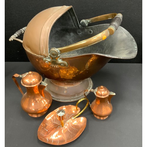 27 - A Copper coal scuttle, Arts and Crafts Lily Pad chamberstick, a set of two Dallah coffee pots (4)