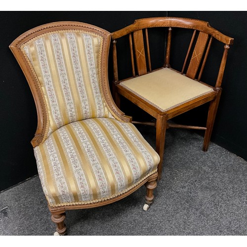 206 - A small 19th century carved walnut nursing chair, striped floral upholstery, turned fore legs, 75cm ... 