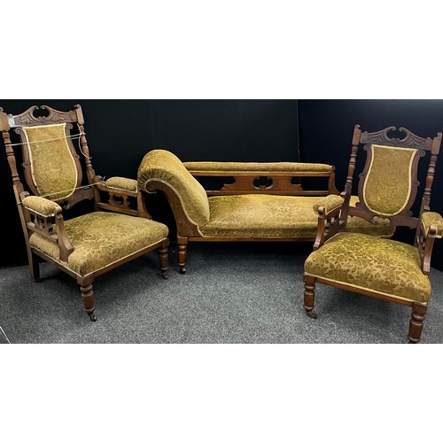 209 - A late Victorian three piece salon suite, chaise longue and pair of arm chairs, carved scrolling and... 