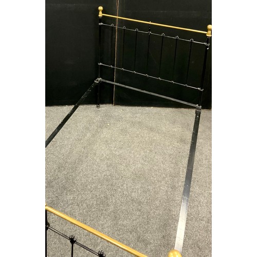 184 - A Victorian style cast iron and brass double bed frame, length 197cm, width 120 cm,height 133cm