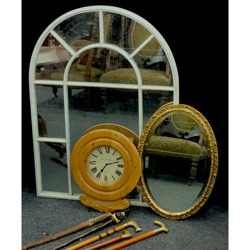 154 - A white multi-panel arched wall mirror,  pine wall clock,  five walkingsticks, one with carved Duck ... 