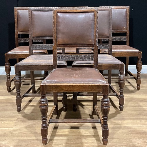 616 - A set of six Jacobean Revival oak dining chairs