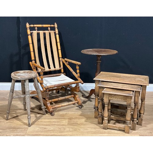 617 - A late 19th/early 20th century American design spring rocking chair; vernacular stool; tripod table;... 