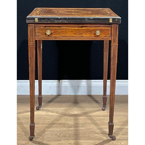 646 - An Edwardian rosewood and marquetry envelope card table, hinged top enclosing a baize lined playing ... 