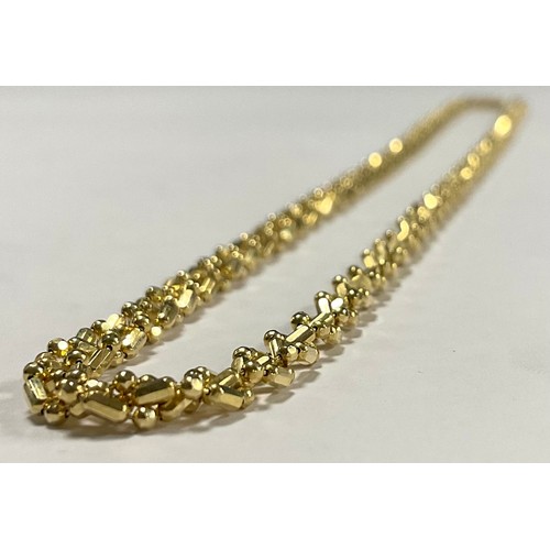 571 - A 14k gold Midas necklace, marked, 13.4g