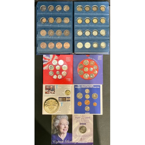 593 - Numismatics - UK coin sets, 1984, 2003 and 2004; QEII 2006 crown; an album of mostly British coins, ... 