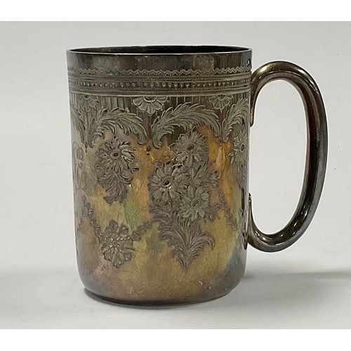 597 - A Victorian silver christening mug, chased and engraved with floral garlands, gilded interior, monog... 