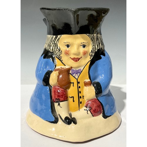 675 - A large Devon pottery Toby jug, decorated in polychrome, possibly shop display, 23cm high