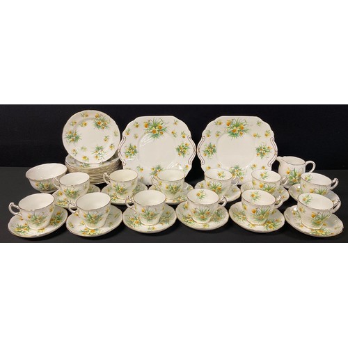 676 - A Hammersley tea set for twelve, printed with daffodils, comprising teacups, saucers, tea plates, pa... 