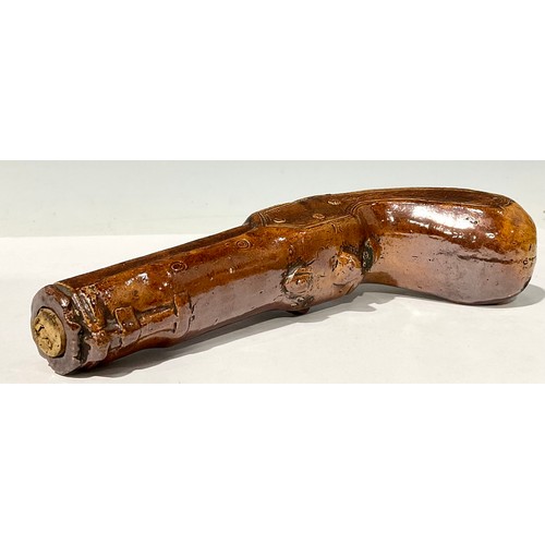 690 - A 19th century Derbyshire brown salt glazed novelty flask, in the form of a pistol, 25cm long, c.184... 