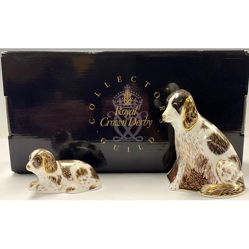 27 - A Royal Crown Derby paperweight, Collector's Guild exclusive Member's Pack with two matching dog pap... 