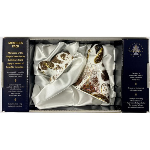 27 - A Royal Crown Derby paperweight, Collector's Guild exclusive Member's Pack with two matching dog pap... 