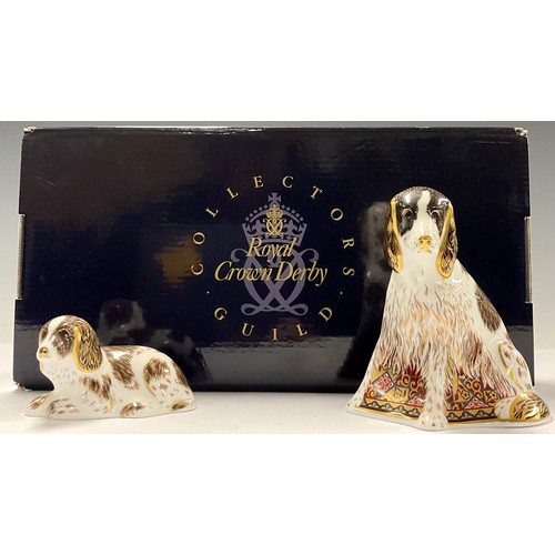 27 - A Royal Crown Derby paperweight, Collector's Guild exclusive Member's Pack with two matching dog pap... 