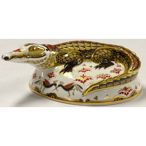 28 - A Royal Crown Derby paperweight, Crocodile, an exclusive gold signature edition commissioned by The ... 