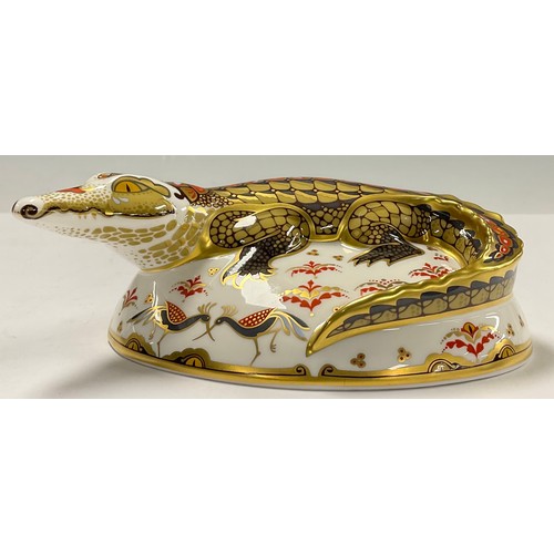 28 - A Royal Crown Derby paperweight, Crocodile, an exclusive gold signature edition commissioned by The ... 