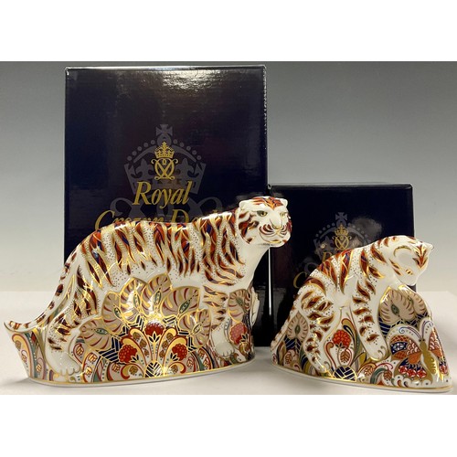 46 - An associated pair of Royal Crown Derby paperweights, Bengal Tiger and Bengal Tiger Cub, gold stoppe... 