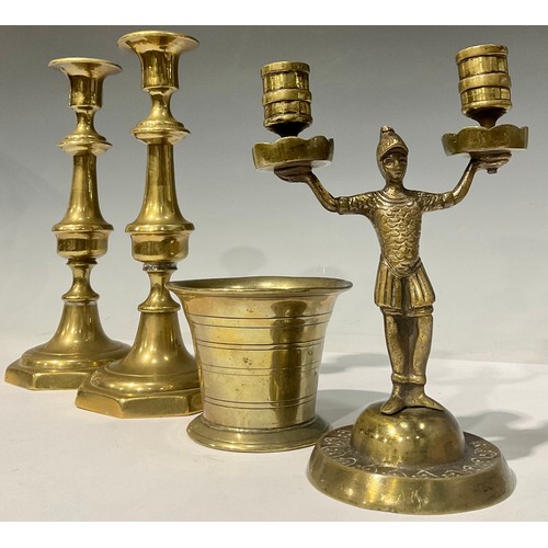 698 - An 18th century bronze mortar, 8cm high; a pair of Victorian brass ejector candlesticks; a bronze tw... 