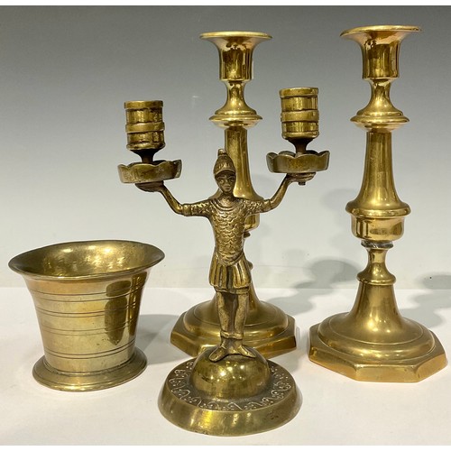 698 - An 18th century bronze mortar, 8cm high; a pair of Victorian brass ejector candlesticks; a bronze tw... 