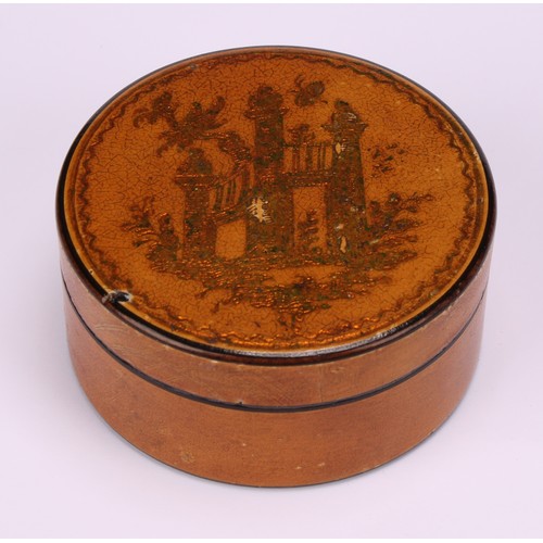 699 - An early 19th century vernis martin circular snuff box, the push-fitting cover decorated in gilt wit... 