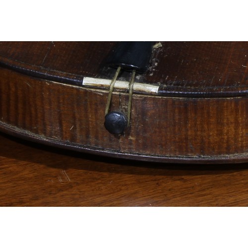 711 - Musical Instruments - a violin, the two-piece back 35.5cm excluding button, ebonised tuning pegs, ou... 