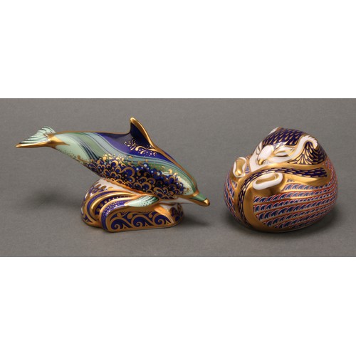 69 - A pair of Royal Crown Derby paperweights, Baby Bottlenose Dolphin, 12cm long, silver stopper, and Sl... 