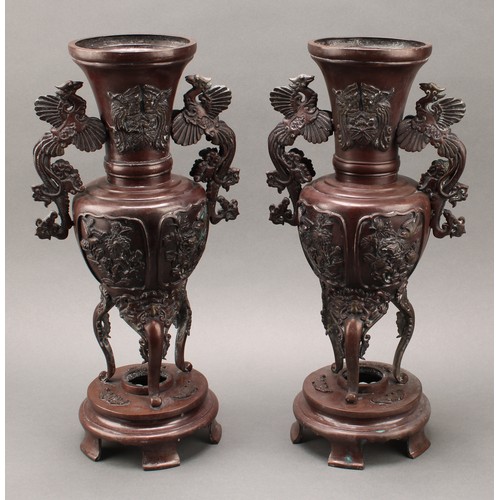 44 - A pair of large Japanese Meiji period patinated bronze shouldered vases on stands, the tapering neck... 