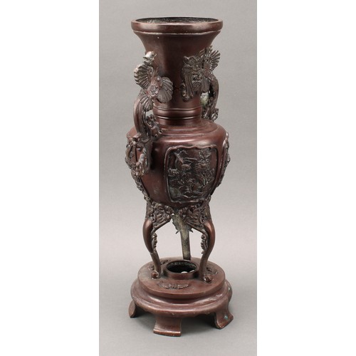 44 - A pair of large Japanese Meiji period patinated bronze shouldered vases on stands, the tapering neck... 