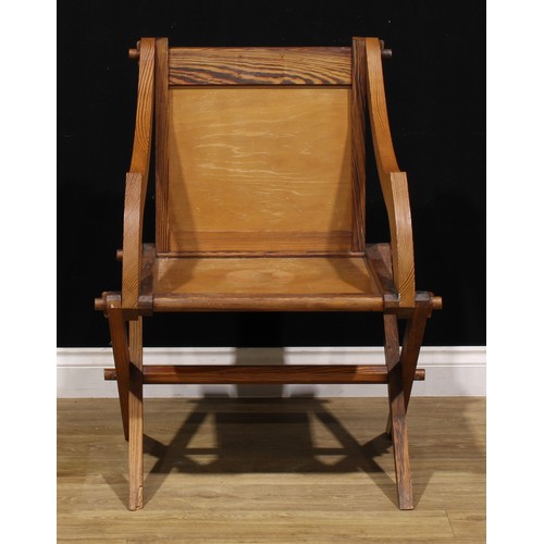 93 - An Arts & Crafts period pitch pine Glastonbury chair, of traditional Post-Medieval Gothic form, 89cm... 