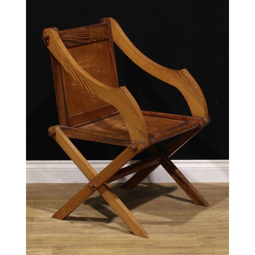 93 - An Arts & Crafts period pitch pine Glastonbury chair, of traditional Post-Medieval Gothic form, 89cm... 