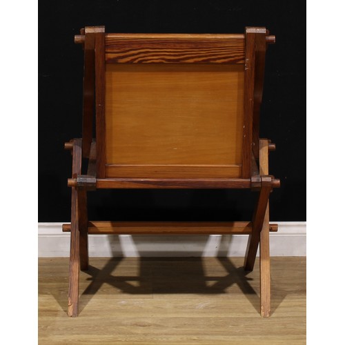 93 - An Arts & Crafts period pitch pine Glastonbury chair, of traditional Post-Medieval Gothic form, 89cm... 