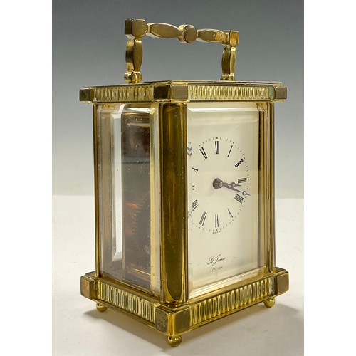 718 - A brass carriage clock, by St James, London, 14.5cm high over handle