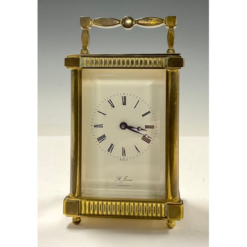 718 - A brass carriage clock, by St James, London, 14.5cm high over handle