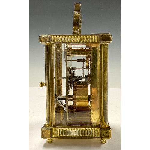 718 - A brass carriage clock, by St James, London, 14.5cm high over handle