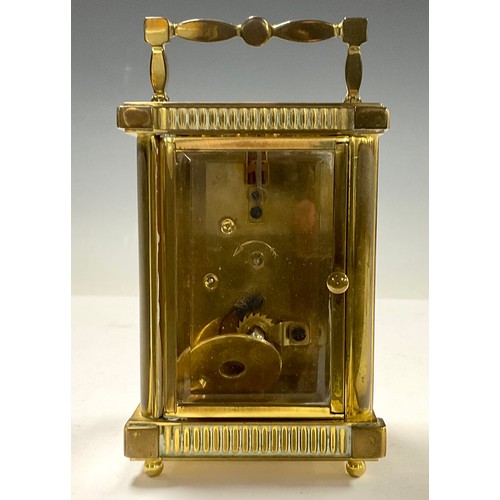 718 - A brass carriage clock, by St James, London, 14.5cm high over handle