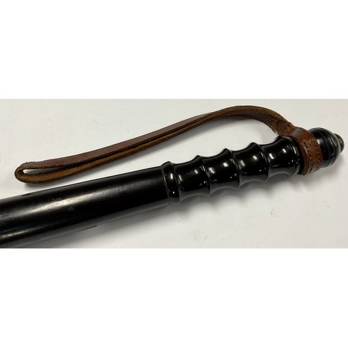 722 - An early 20th century turned lignum vitae police truncheon, 39cm long