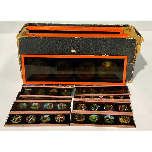 733 - Toys and Juvenalia - a box of twelve 19th century magic lantern slides, Nursery Rhymes, 6cm x 20cm; ... 