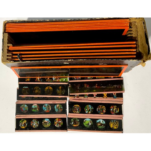 733 - Toys and Juvenalia - a box of twelve 19th century magic lantern slides, Nursery Rhymes, 6cm x 20cm; ... 