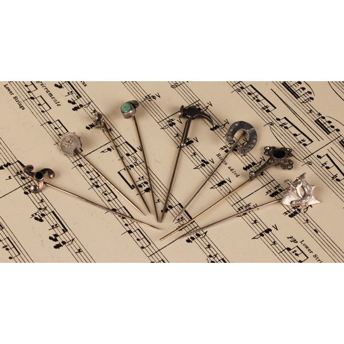 565A - Stick Pins - a silver horseshoe stick pin; a silver and turquoise stick pin in the form of a fruit; ... 