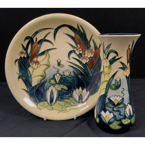 7 - A Moorcroft 'Lamia' pattern plate designed by Rachel Bishop, tubelined yellow and green flowers on y... 