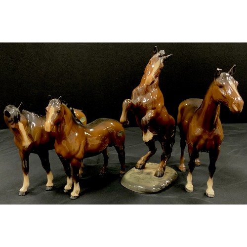 10 - Beswick horses including; Welsh cob rearing, no.1014, others including bay horses, (4).