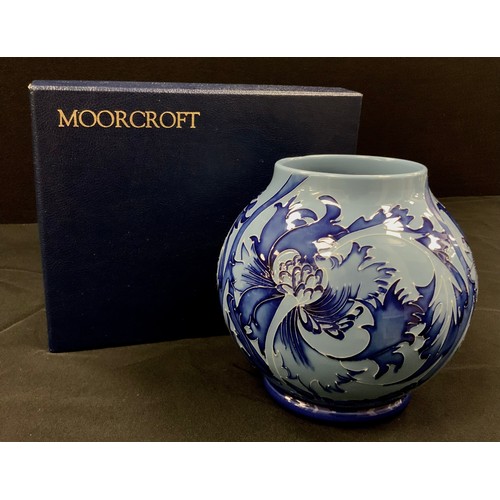 12 - A Moorcroft ‘Florian’ pattern ovoid vase, two tone blue decoration, second quality, 17cm high, boxed... 