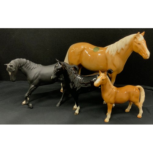 31 - Beswick horses and others including; Beswick Black Magic horse, black gloss, 20cm high, Black beauty... 